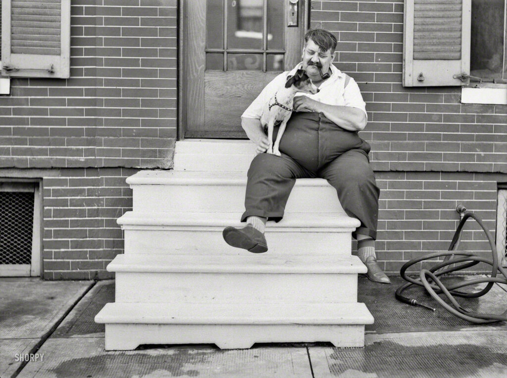 July 1938. "Man who lives in row house. Baltimore, Maryland." Walkies, anyone? Photo by John Vachon for the Resettlement Administration.