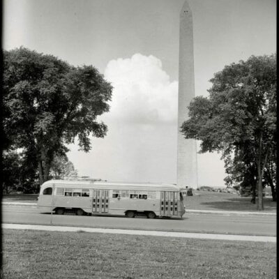 Streamlined street car passing Washington Monument (1938)