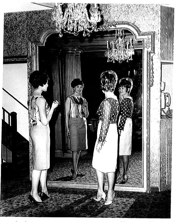 Ladies admiring themselves in the mirror - maybe early 70s