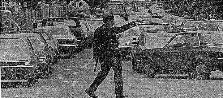 Policeman directing traffic (1975)