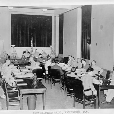 Nazi saboteur trial, Washington, D.C. The special seven-man military commission opens the third day of its proceedings in the trial of eight Nazi saboteurs in the fifth floor courtroom of the Department of Justice building. Sitting on the commission left to right are: Brigadier General John T. Lewis; Major General Lorenzo D. Casser; Major General Walter S. Grant; Major General Frank R. McCoy, president of the commission; Major General Blanton Winship; Brigadier General Guy V. Henry; Brigadier General John T. Kennedy. (Wikipedia)
