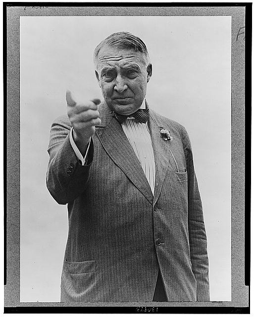 Warren Harding, half-length portrait, standing, facing front, gesturing with right hand
