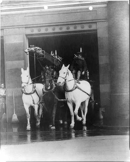 Fire Department activities: horse-drawn hook & ladder truck leaving firehouse (Library of Congress)