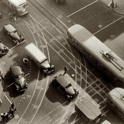 Aerial view in front of the Willard Hotel at 14th Street and Pennsylvania Avenue, showing pedestrians and rather dense traffic in autos and streetcars. - 1939