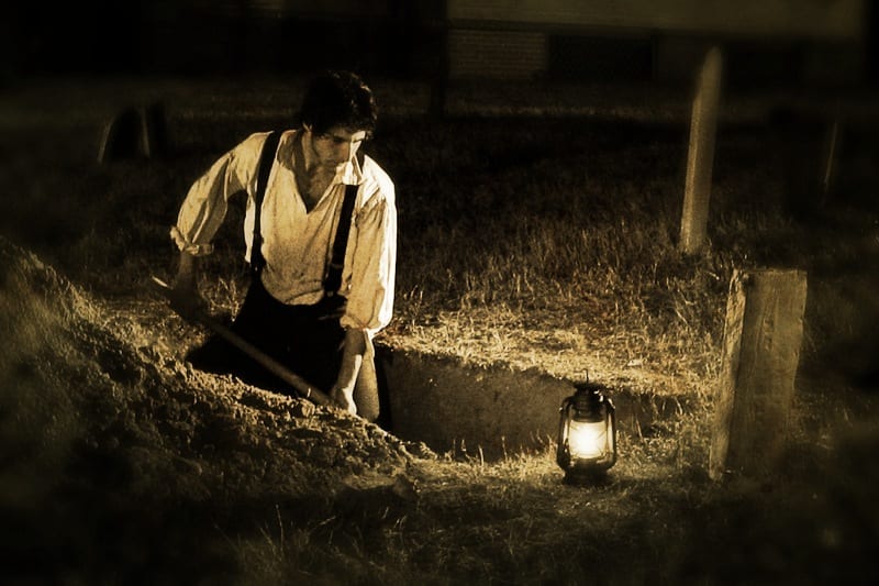 guy digging grave