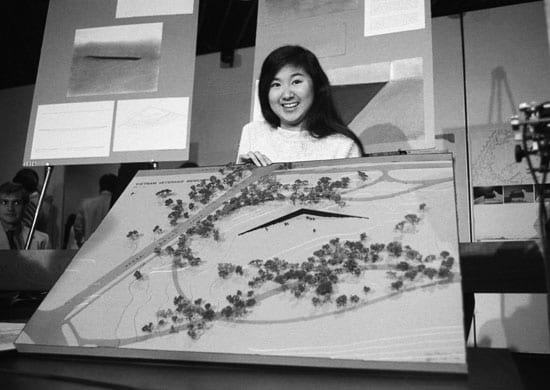 Maya Ying Lin, the Yale architecture student who submitted the winning design for the Vietnam Veterans’ Memorial, holds a scale model of her design on May 6, 1981. © Bettmann/CORBIS  (mentalfloss.com