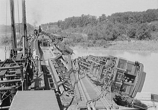 Wreck of the Crescent Limited train on the Pennsylvania Railroad Bridge over the Anacostia River in Washington, D.C., in the United States. Flood waters from a storm undermined the bridge's pilings, which led to the crash on August 24, 1933. The engineer died in the wreck. (Library of Congress)