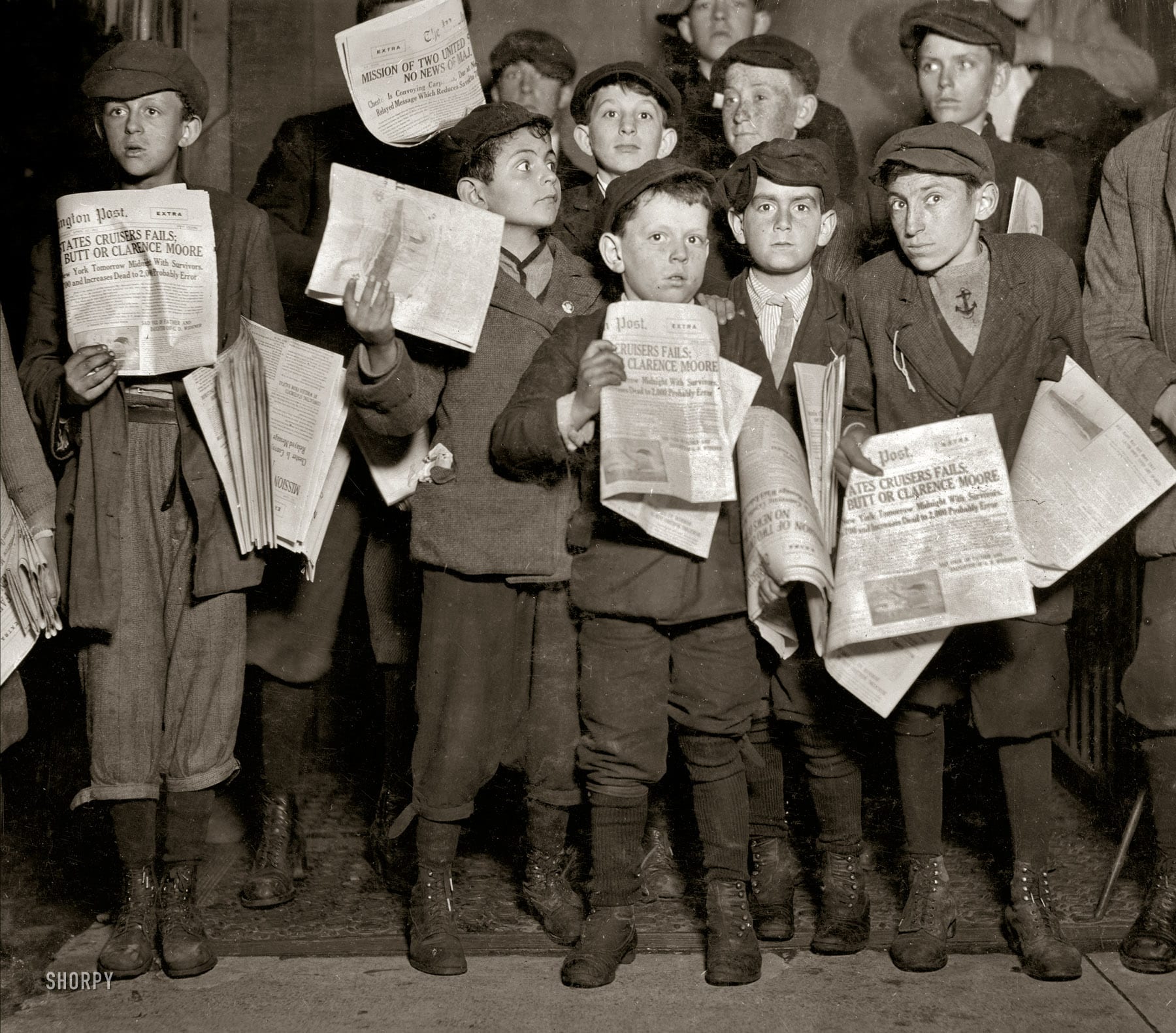 Washington, D.C. -- news of the Titanic and possible survivors. "After midnight April 17, 1912, and still selling extras, 12th Street near G. There were many of these groups of young newsboys selling very late these nights. Youngest boy in the group is Israel Spril (9 years old), 314 I Street N.W.; Harry Shapiro (11 years old), 95 L Street N.W.; Eugene Butler, 310 (rear) 13th Street N.W. The rest were a little older." (Shorpy)