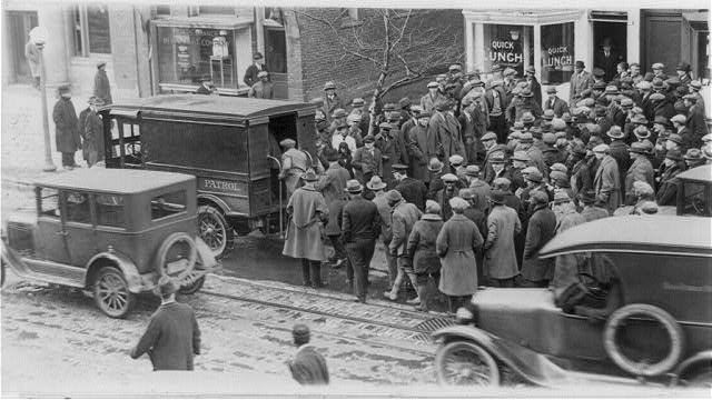 Police raid a gambler's den. Several loads of book makers were taken from the E. St. address by the police (Library of Congress)