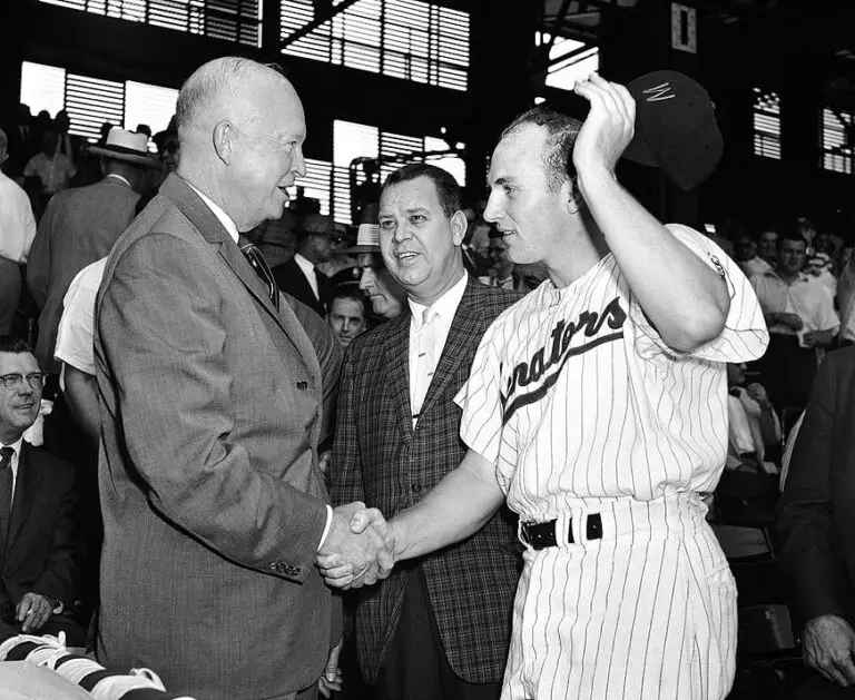 Harmon Killebrew shakes President Eisenhower's hand before a game in 1959 (Calvin Griffith in the middle)