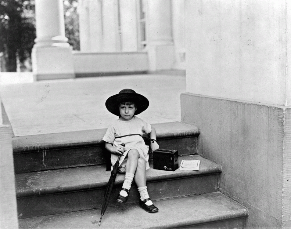 June 29, 1922. Little Miss Tarkington waits on the White House steps to snap a picture of President Warren G. Harding