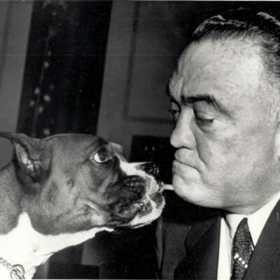 Hoover posing with a boxer at a New York City dog show