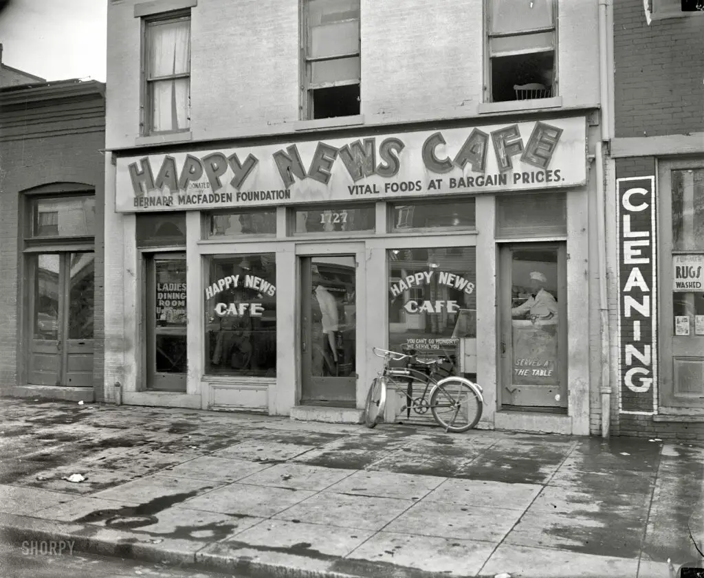 Washington, D.C., circa 1937. Exterior of the Happy News Cafe (described in a 1933 news item as "the new dietitian restaurant for the unemployed") at 1727 Seventh Street N.W. Harris & Ewing Collection glass negative.