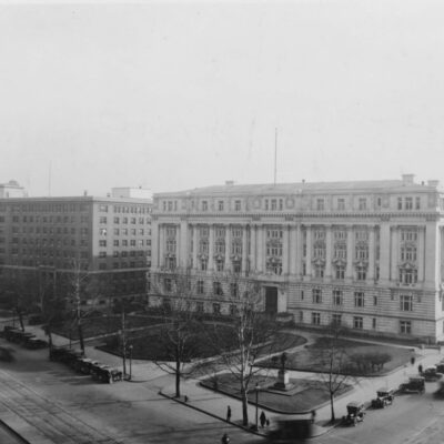 Looking southwest at the Old Post Office Pavilion (far left), Southern Railway Building (middle), and District Building on Pennsylvania Avenue NW in Washington, D.C., in 1932. On in the fall of 1932, the structures in rear of the District Building would be razed to make way for the U.S. Department of Labor building, whose cornerstone would be laid on December 15, 1932