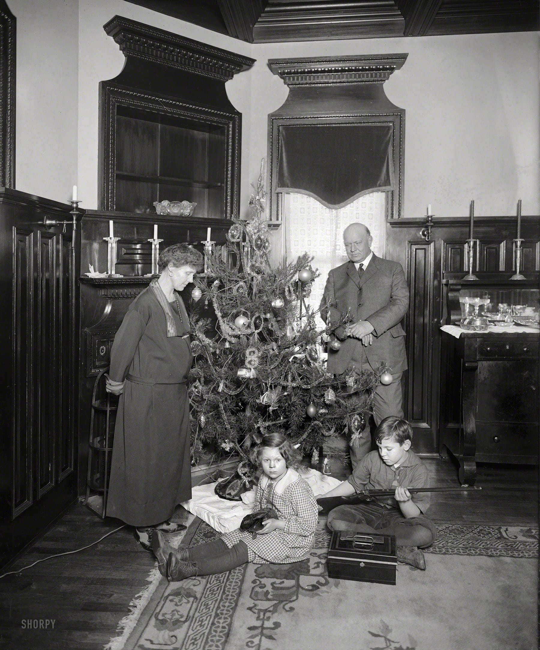 Washington, D.C., circa 1922. "Denby Christmas tree." Junior remembers this as the best Christmas ever! His gun-giving dad is Secretary of the Navy Edwin Denby. National Photo Company glass negative.