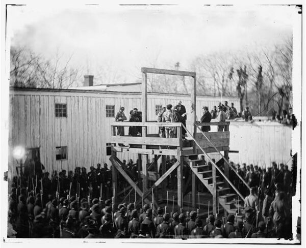 a death warrant being read to inmate Wirz on the gallows