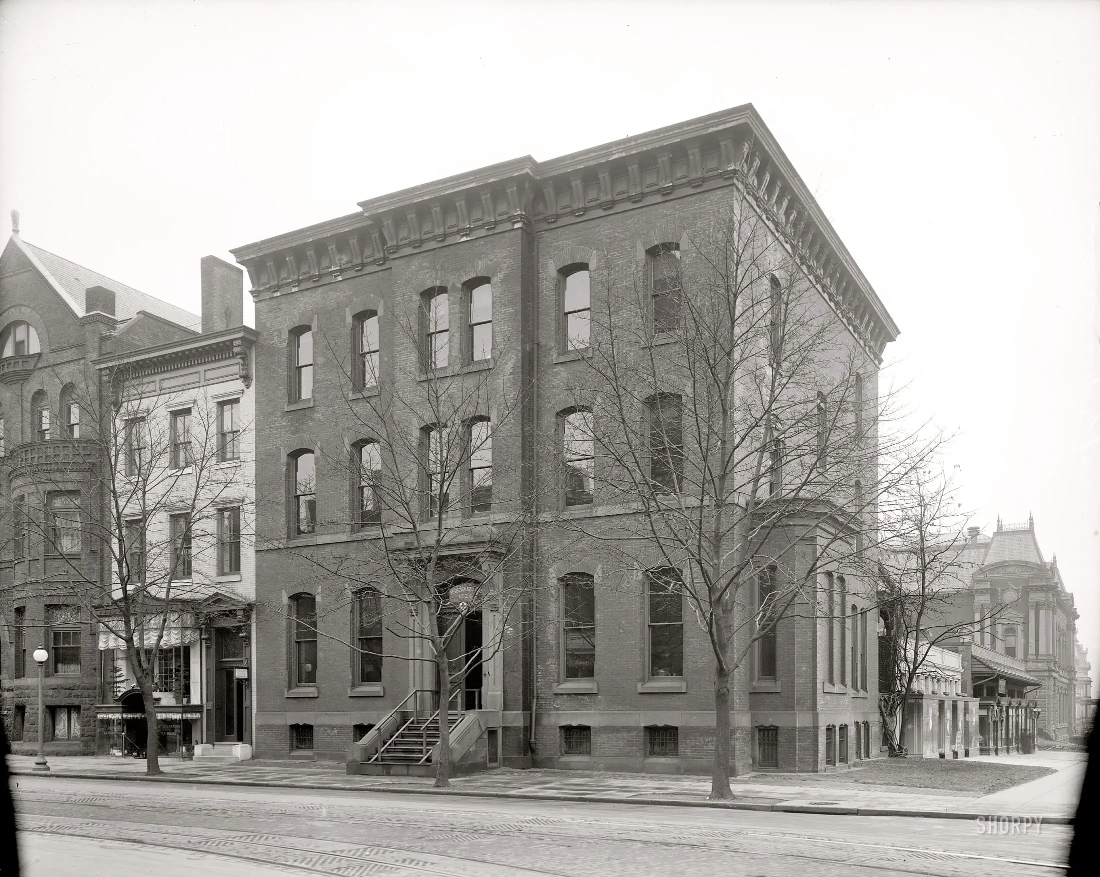  Washington, D.C., circa 1916. An uncaptioned street scene showing a Red Cross building, a "Dermatological Institute," a handicraft school and the Lotos Lantern Tea House. Harris & Ewing Collection glass negative. 
