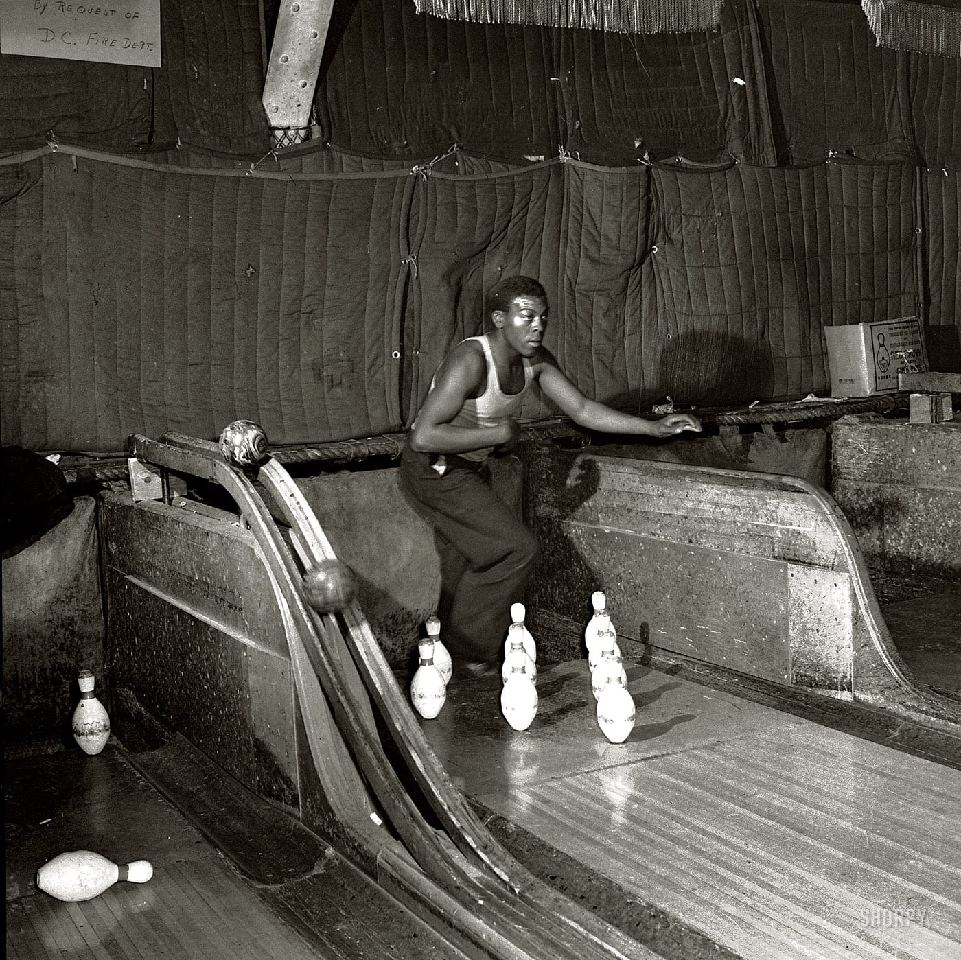 April 1943. Washington, D.C. "Pin boy at a bowling alley." Nitrate negative by Esther Bubley for the Office of War Information.