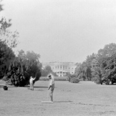 gardeners sweeping the White House lawn