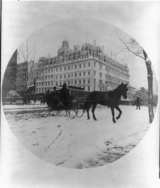 Photo shows a horse-drawn sleigh carrying what may be Melinda and Elise Painter across 14th St. at F St. in front of the Ebbitt House hotel. The modest buildings to the right of the grand hotel housed Newspaper Row, and just across the street at number 501 was Painter's office as Washington correspondent for the Philadelphia Inquirer. (Source: Ison article on Painter, 1990)