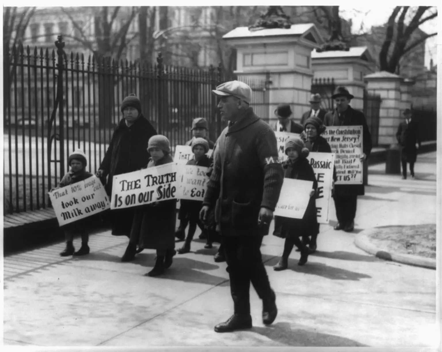 Four adults and six children, from Passaic, N.J., picket the White House following President Coolidge's refusal to listen to their complaints about wage cuts in the textile industry