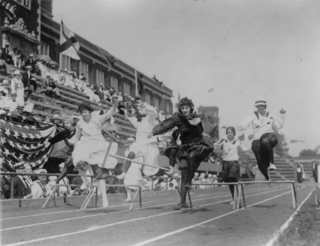 Women competing in low hurdle race