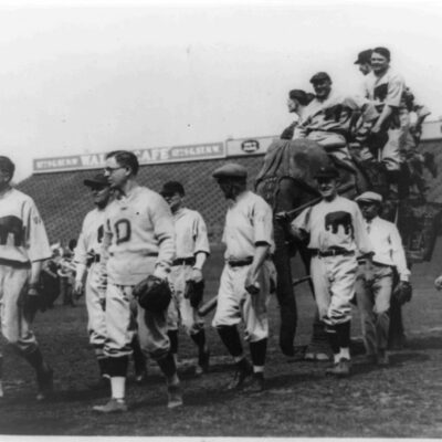 Members of the Republican baseball team of the House of Representatives parading around the field at American League Park