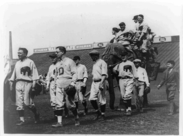 Members of the Republican baseball team of the House of Representatives parading around the field at American League Park