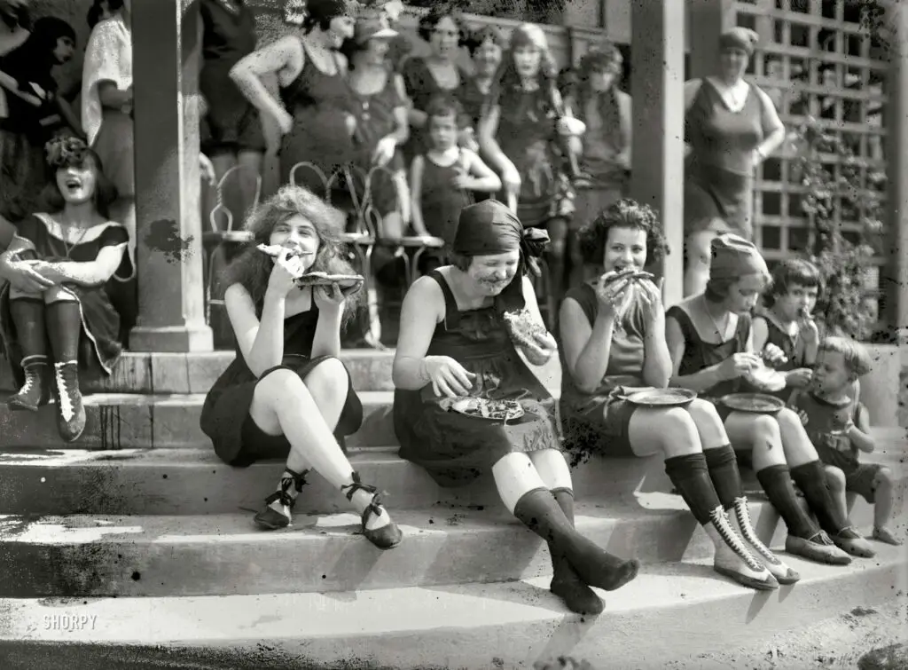 July 31, 1921. Washington, D.C. "Pie eating contest at Tidal Basin bathing beach." In the back row: the blurry but unmistakable facial contours of Iola Swinnerton. National Photo Company Collection glass negative.