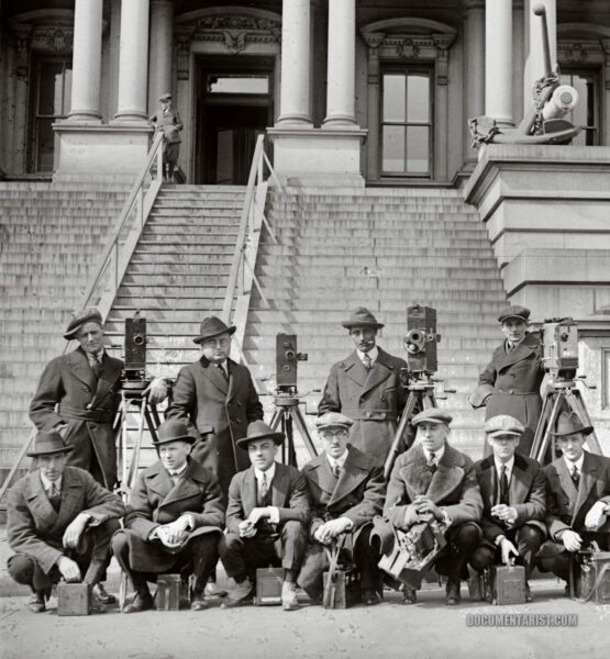 cameramen posing in front of the State, War, and Navy Building