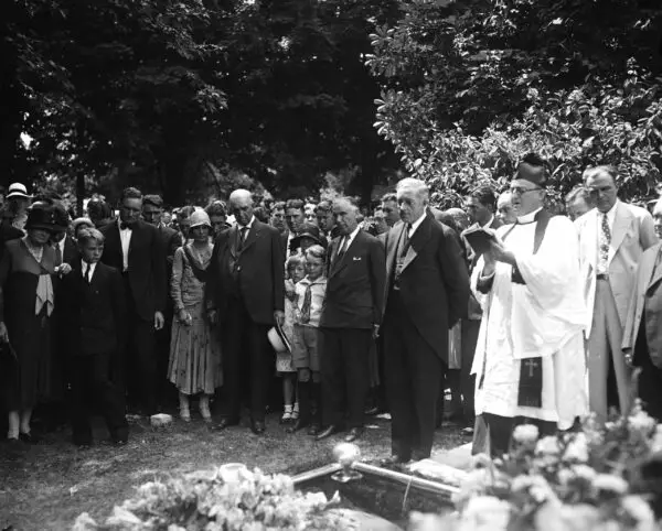 Walter Johnson's wife buried. This photograph was taken at the funeral of Mrs. Walter Johnson, wife of the manager of the Washington baseball club. Those in the picture, reading from left to right, include: Mrs. Frank N. Johnson of Coffeyville, Kas., his mother; Walter Johnson; Edwin Johnson, a son; Edwin R. Roberts, Mayor of Reno candidate for the governorship of Nevada, Mrs. Johnson's father; Carolyn and Robert, two of the younger Johnson children, and at the extreme right, the Rev. Joseph E. Williams, pastor of the Bethesda, Md. Episcopal Church, where the Johnsons worshipped
