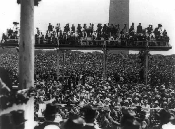 Photographers on platform above crowd at Charles A. Lindbergh speech at the Washington Monument in Washington, D.C.