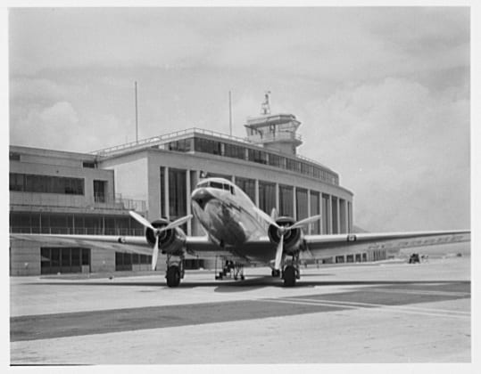 National Airport. Plane beside building and control tower at National Airport