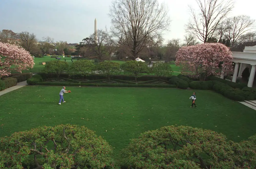William Jefferson Clinton and Hillary Rodham Clinton play catch in the Rose Garden. They are practicing for upcoming opening pitch ceremonies that both of them will participate in. 4/3/94.