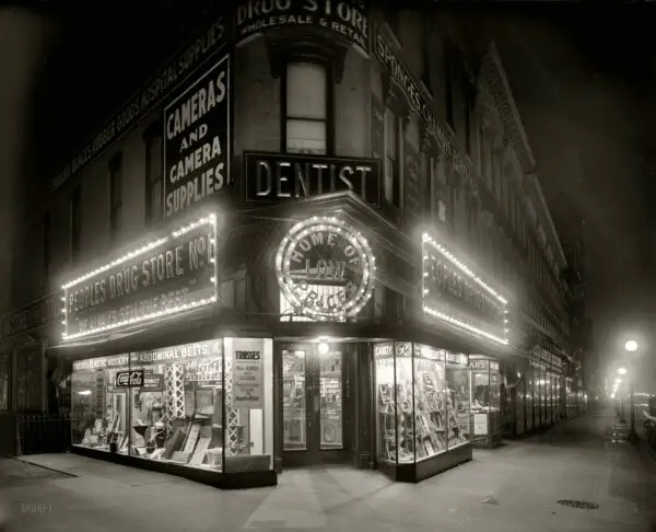 Washington, D.C., circa 1921. "People's Drug Store, Seventh & K, night." With a lurid display of "trusses and rubber goods." National Photo Co.