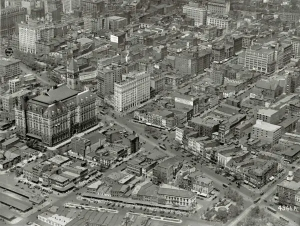 Washington, D.C., circa 1922. "Star Building from air." The Washington Star newspaper building at the center is at the intersection of 11th Street N.W. and Pennsylvania Avenue, which runs diagonally across the photo. The big building with the tower us the Old Post Office. There's a lot to see here, including laundry hung out to dry. National Photo Company glass negative.