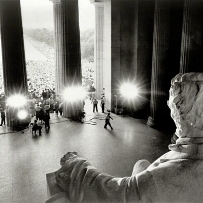 August 28, 1963. "Emancipator looking down on demonstrators. Participants in the March on Washington in front of the Lincoln Memorial and massed along both sides of the Reflecting Pool, viewed from behind Abraham Lincoln statue." Photo by James K. Atherton for United Press International.