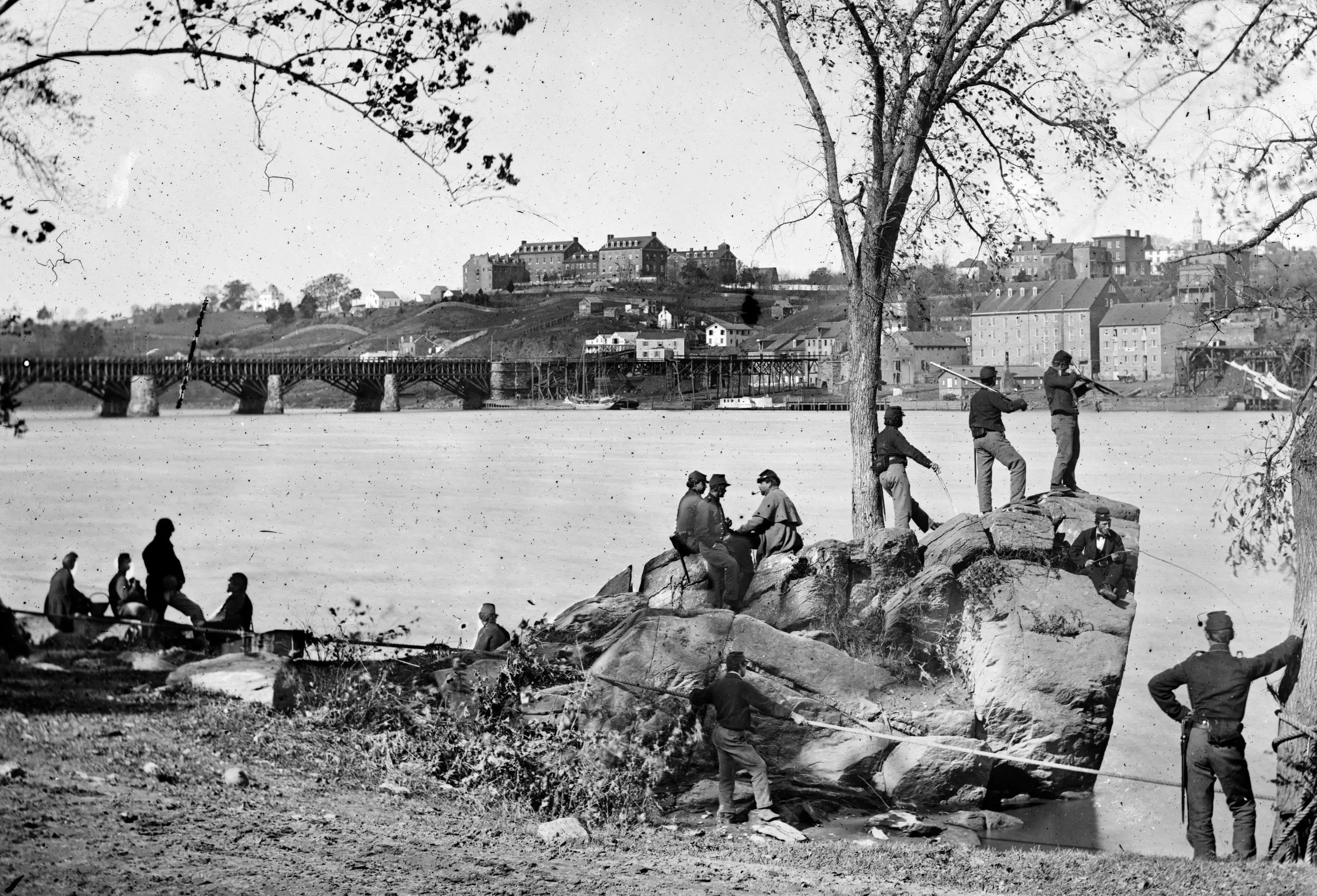 Union soldiers guarding the Potomac River in Washington, DC in 1861. Georgetown University is visible in the background. Photo by George Barnard