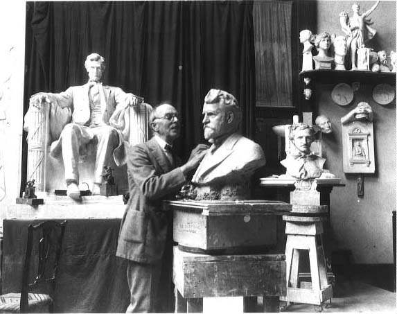 Picture of Daniel Chester French in his studio with Lincoln Memorial statue in the background