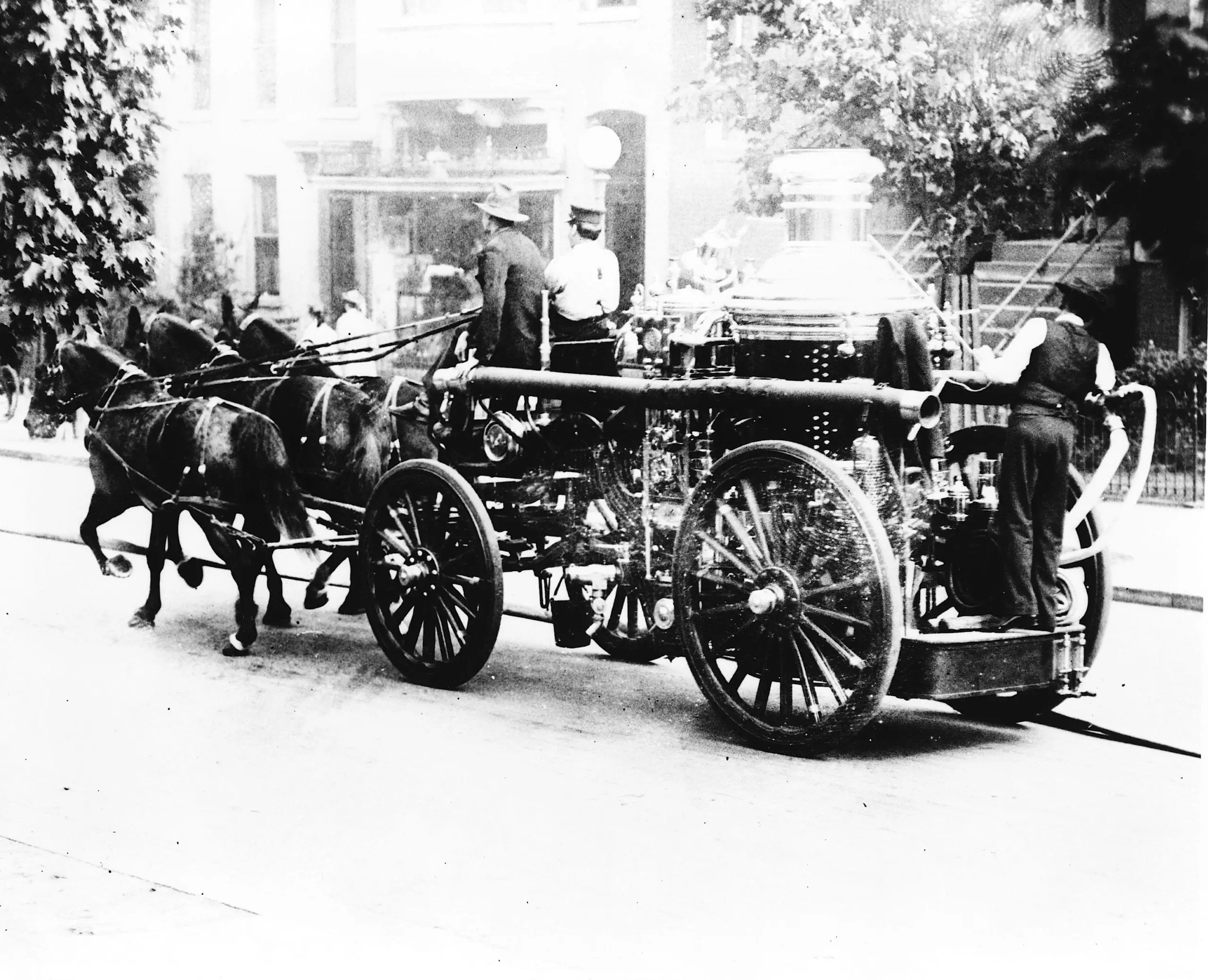 Three firemen on fire engine drawn by three horses, Washington, D.C.
