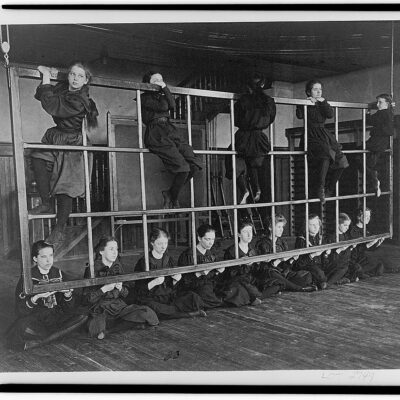 Women at Western High School posing on an exercise device