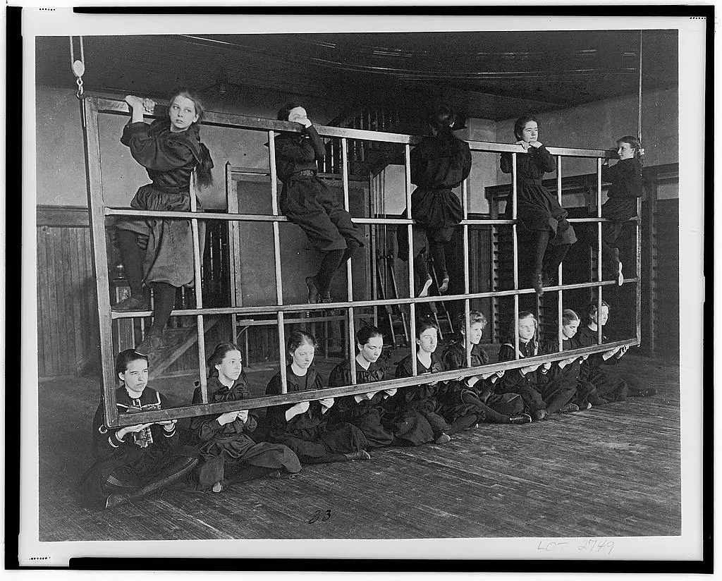Women at Western High School posing on an exercise device