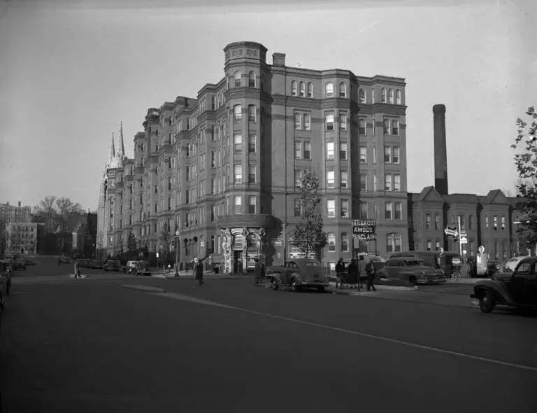 The Dunbar Hotel, located on 15th street between U and V streets NW. Designed by Clement A. Didden, Jr. the hotel had 485 bedrooms. Demolished in 1974. Automobiles are shown on the street, pedestrians on the sidewalk, and a gas station with a "Texaco / Amoc / Sinclair" sign. "Ansco Safety Film" edge imprint. Negative uncaptioned.
