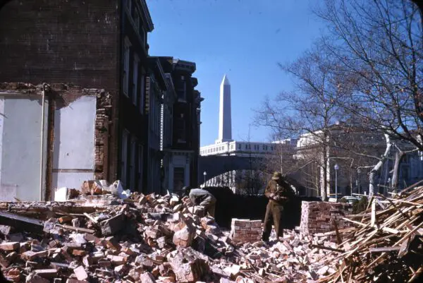 Demolition of buildings on the corner of 11th Street and Virginia Avenue SW. View northwest over the Agriculture Department Building to the Washington Monument (1959). Garnet W. Jex "Southwest Redevelopment" Slide Collection, HSW.