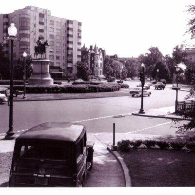 Scott Circle, NW, looking northeast from Rhode Island Avenue with statue of Gen. Winfield Scott; note glass street sign under globe. (July 8, 1950