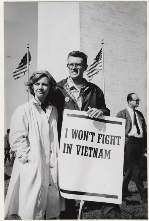 The clean-cut collegiate looks of these two young peace activists do not fit the common stereotype of the long-haired radicals and "peaceniks" who protested against the escalating war in Southeast Asia. They were joined by several hundred thousand anti-war protestors who descended upon the nation's capitol to dissent against what they believed was an immoral war.