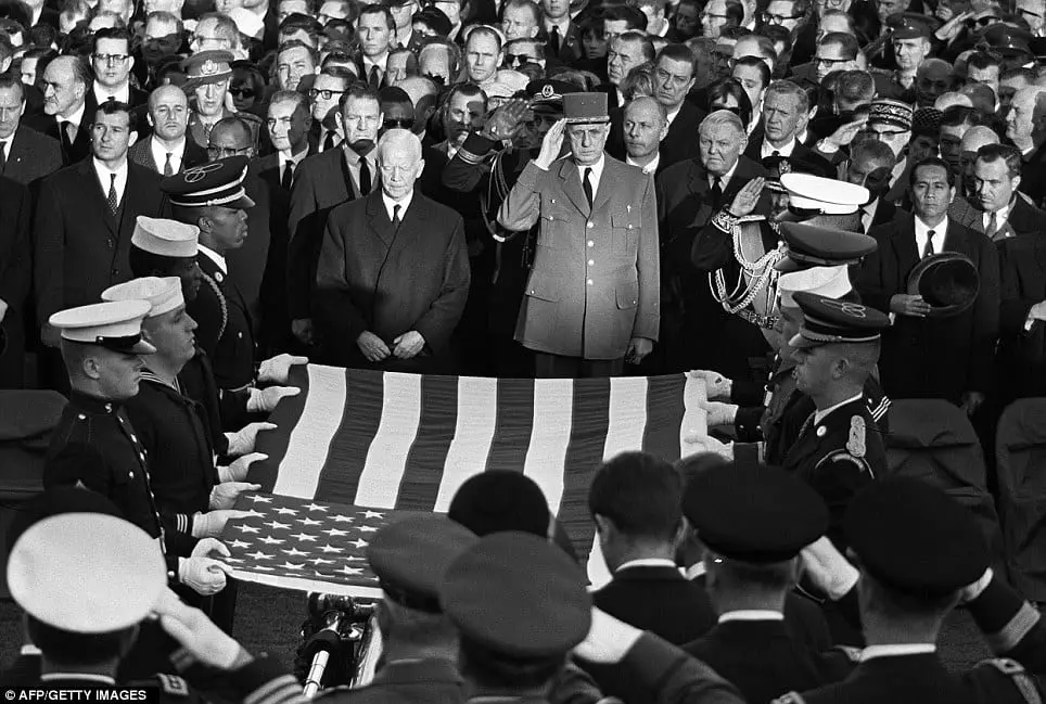 Distinguished mourners: German President Heinrich Luebke, French President General Charles de Gaulle, Germany's Chancellor Ludwig Erhard and French Premier Maurice Couve de Murville (from left to right) pay respect to the flag-draped coffin of the late US President John Fitzgerald Kennedy in front of the Capitol in Washington