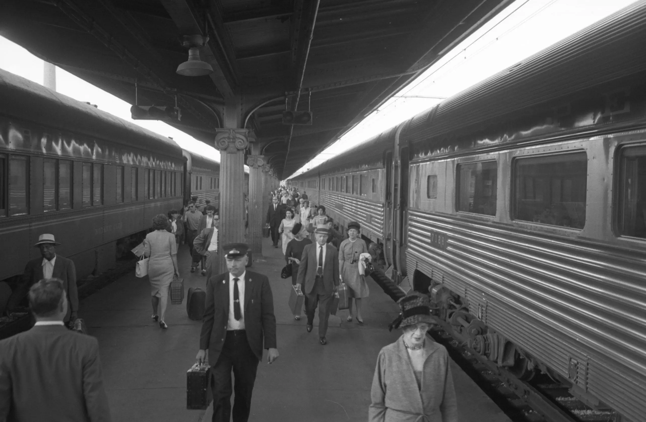 Passengers and train employees walking near trains, Union Station, Washington, D.C.