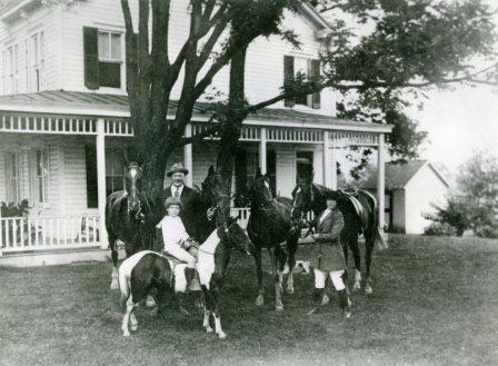 Andrew J. Cummings, Jr., on his pony "Sugar," Andrew J. “Cy” Cummings, and Zelpha Cummings, c. 1920-1923. From a print lent by Andrew J. Cummings, Jr. CCHS 2008.12.06.