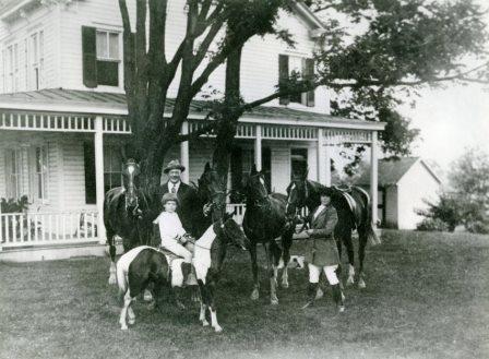 Andrew J. Cummings, Jr., on his pony "Sugar," Andrew J. “Cy” Cummings, and Zelpha Cummings, c. 1920-1923.  From a print lent by Andrew J. Cummings, Jr. CCHS 2008.12.06.